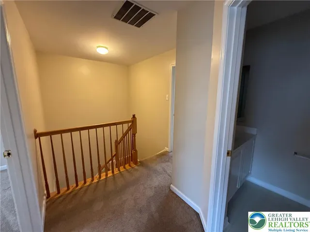 a view of a house with backyard and porch