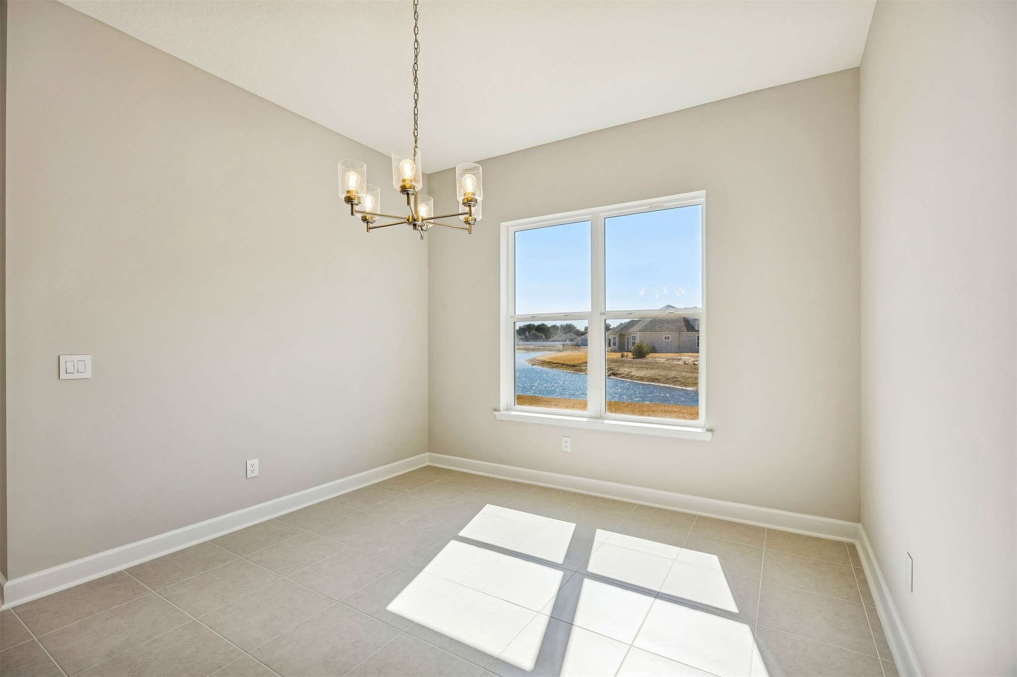 85417 Sandy Rdg Loop Yulee, FL 32097 - Photo 8 of 21 an empty room with a window and a ceiling fan