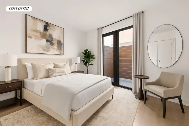 a bedroom with a bed a mirror and a large window