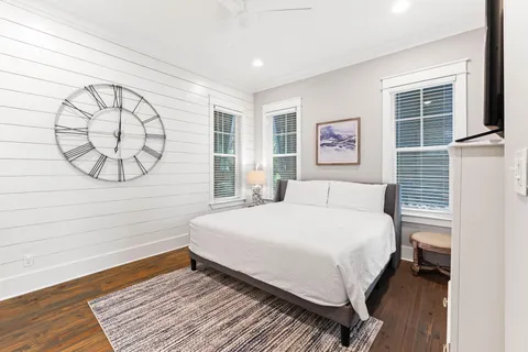 a bathroom with a granite countertop sink a toilet and a bathtub