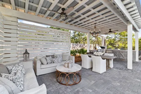 a view of a chairs and table in the patio