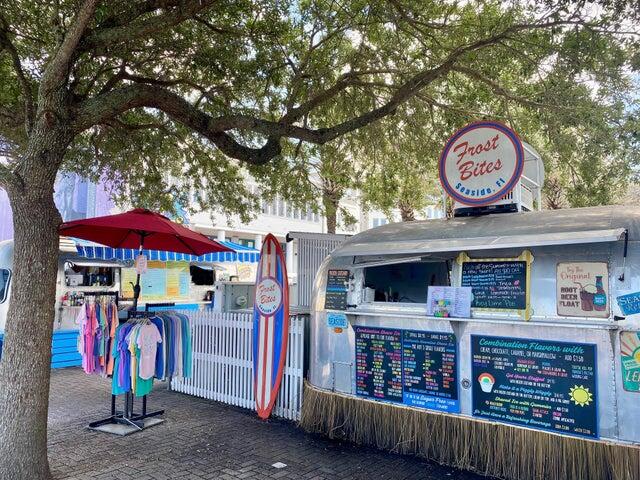 47 Trail Lane Santa Rosa Beach, FL 32459 - Photo 51 of 53 a area with lots of furniture and umbrella