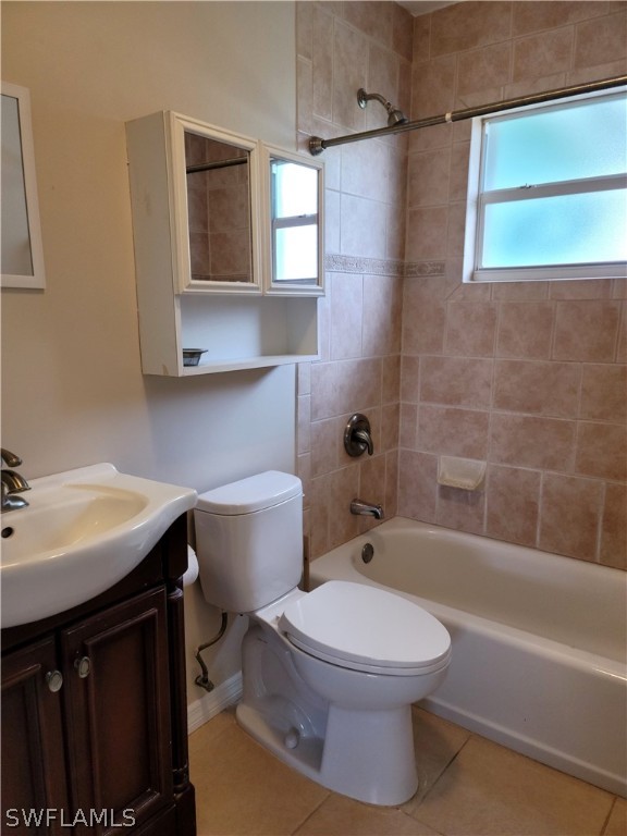 1509 Lindale Circle Lehigh Acres, FL 33936 - Photo 11 of 16 a bathroom with a toilet a sink and bathtub