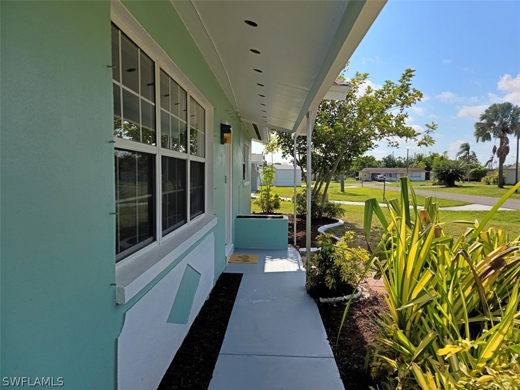 1509 Lindale Circle Lehigh Acres, FL 33936 - Photo 2 of 16 a view of a bunch of flowers in a balcony