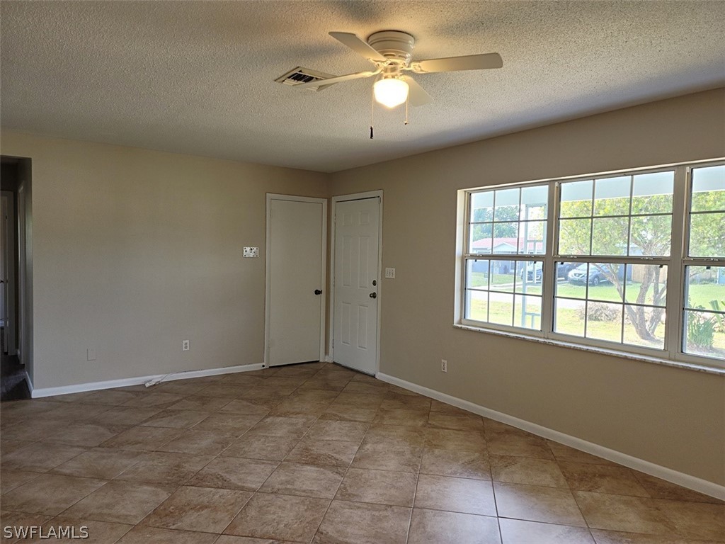 1509 Lindale Circle Lehigh Acres, FL 33936 - Photo 3 of 16 a view of an empty room with a window