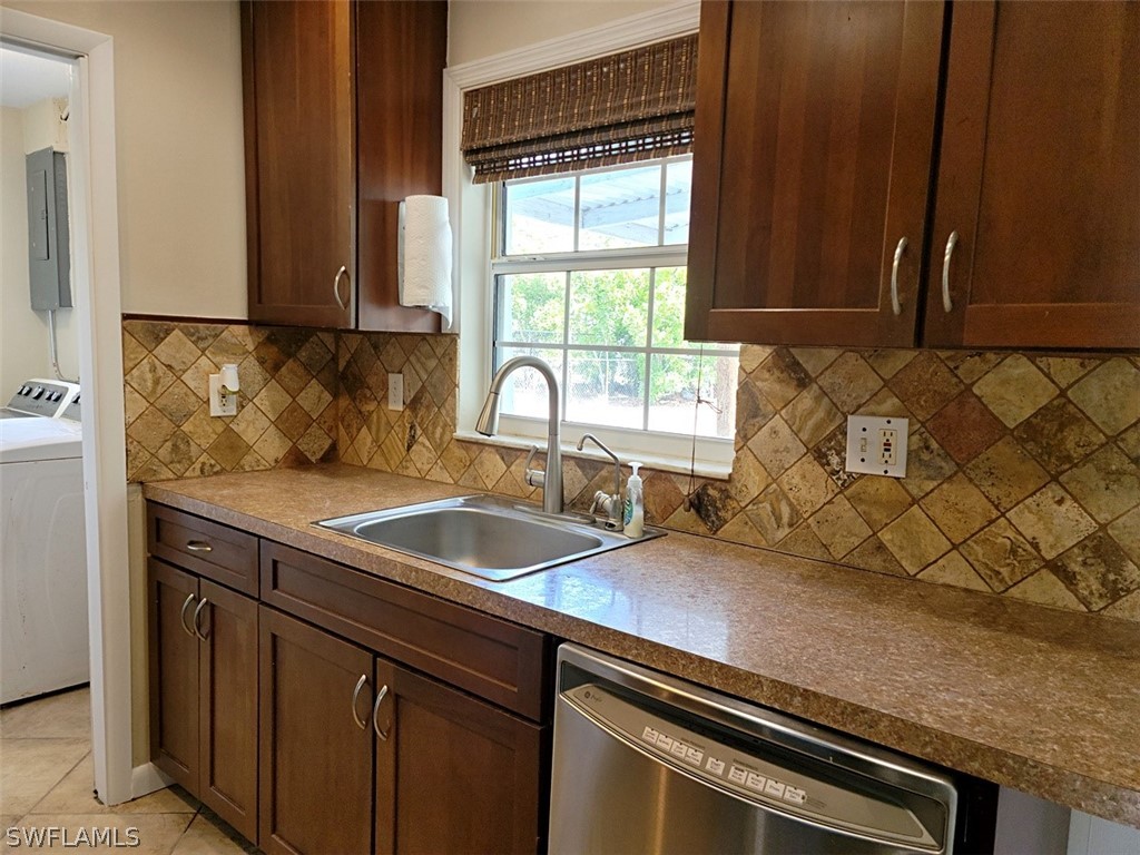 1509 Lindale Circle Lehigh Acres, FL 33936 - Photo 6 of 16 a kitchen with a sink and a window