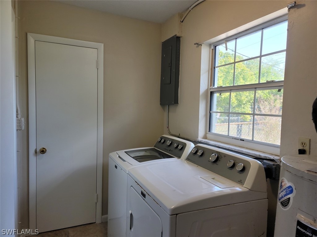 1509 Lindale Circle Lehigh Acres, FL 33936 - Photo 7 of 16 a utility room with dryer and washer