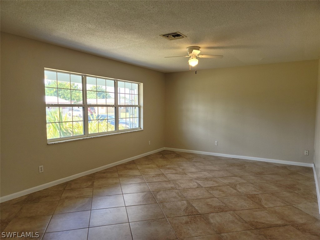 1509 Lindale Circle Lehigh Acres, FL 33936 - Photo 8 of 16 a view of an empty room with a window