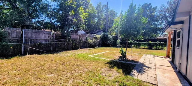a swimming pool with some trees in the background