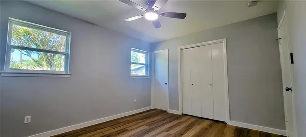 a view of room with window and ceiling fan