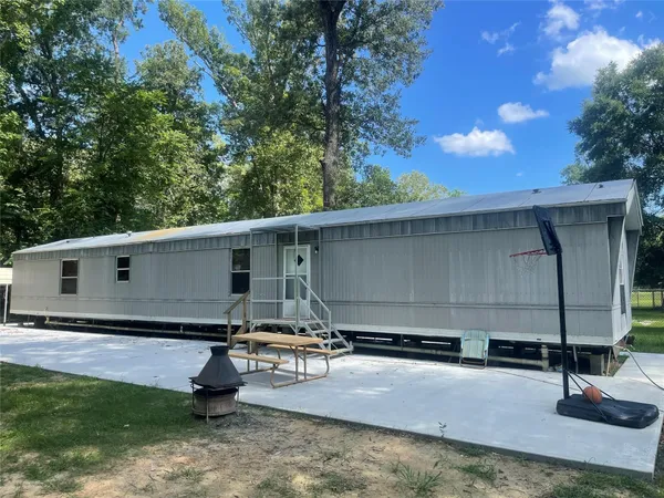 a house view with a backyard space