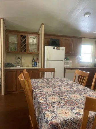 a kitchen with granite countertop a sink and cabinets