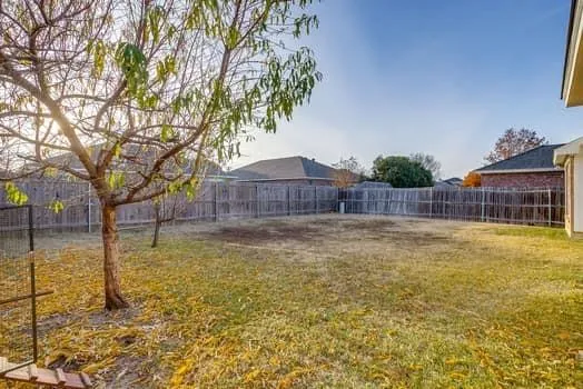 a swimming pool with some trees in the background