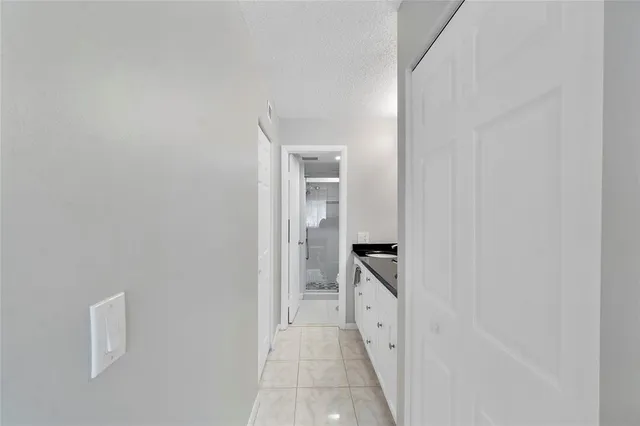 a view of a bathroom from the hallway