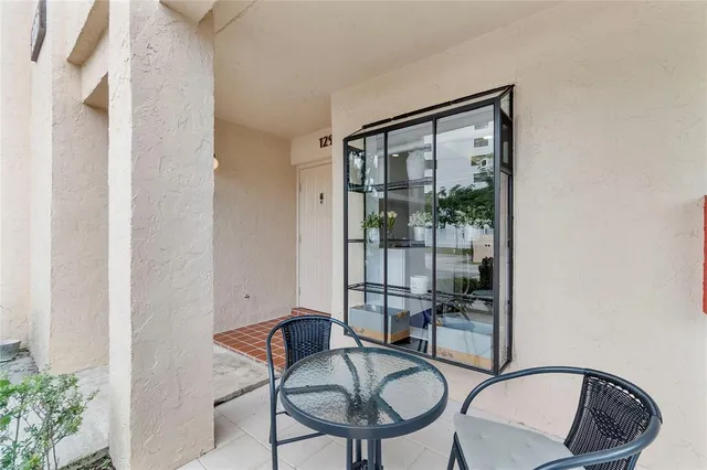 a view of a balcony and chairs
