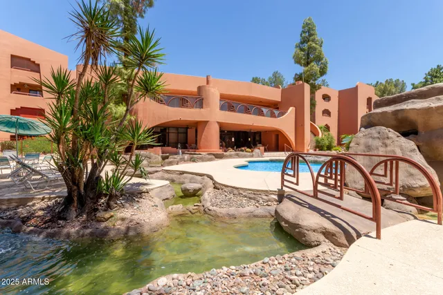 a view of a swimming pool with a lounge chairs