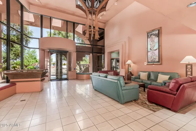 a living room with furniture and a large window