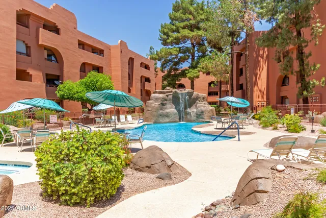 a view of a swimming pool with a lounge chairs