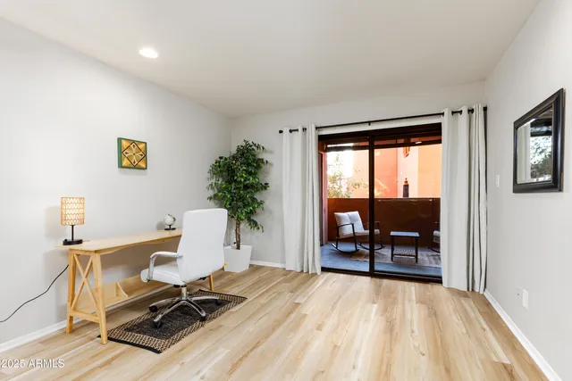 a workspace with furniture and a window