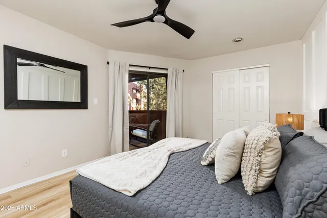 a bedroom with a bed and closet