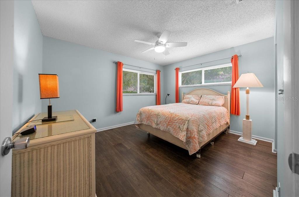 8720 Southwest 90th Street, Unit A Ocala, FL 34481 - Photo 28 of 71 a bedroom with a bed and a flat screen tv
