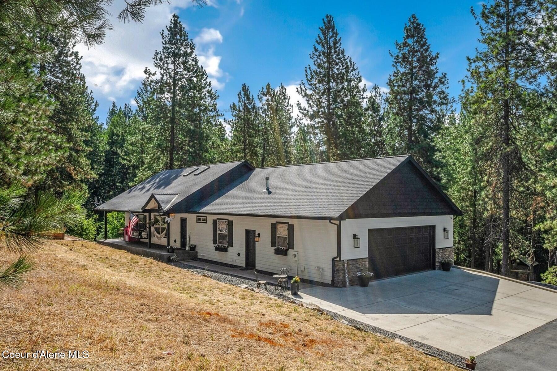 14558 North Saddle Ridge Road Rathdrum, ID 83858 - Photo 1 of 51 Tucked in the Woods