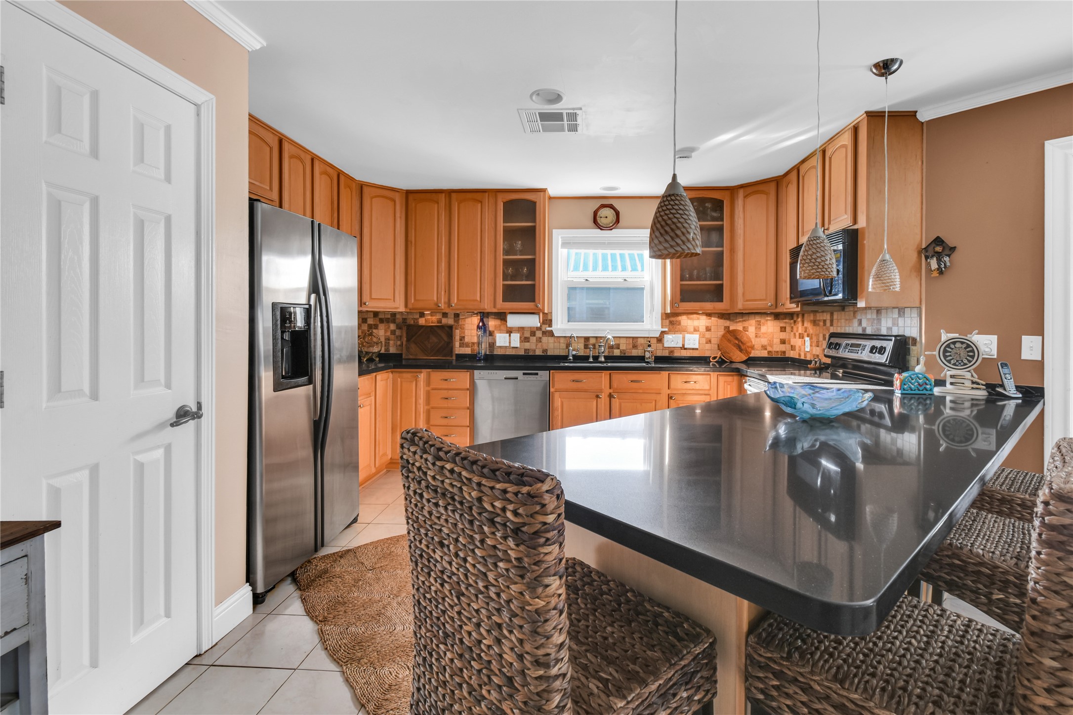 114 Four Master Road Freeport, TX 77541 - Photo 17 of 37 a kitchen with stainless steel appliances granite countertop a sink refrigerator and cabinets