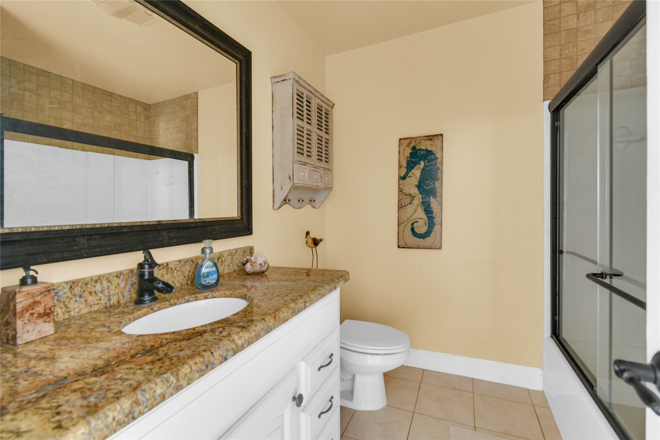 114 Four Master Road Freeport, TX 77541 - Photo 24 of 37 a bathroom with a granite countertop sink and a mirror