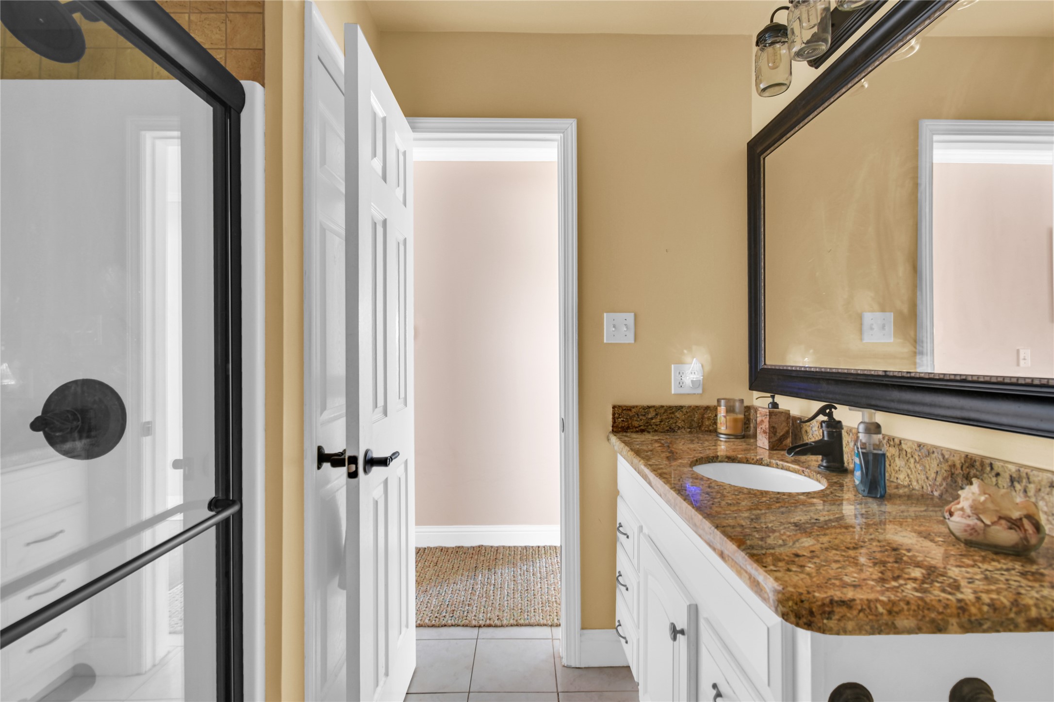 114 Four Master Road Freeport, TX 77541 - Photo 25 of 37 a bathroom with a granite countertop sink and a mirror