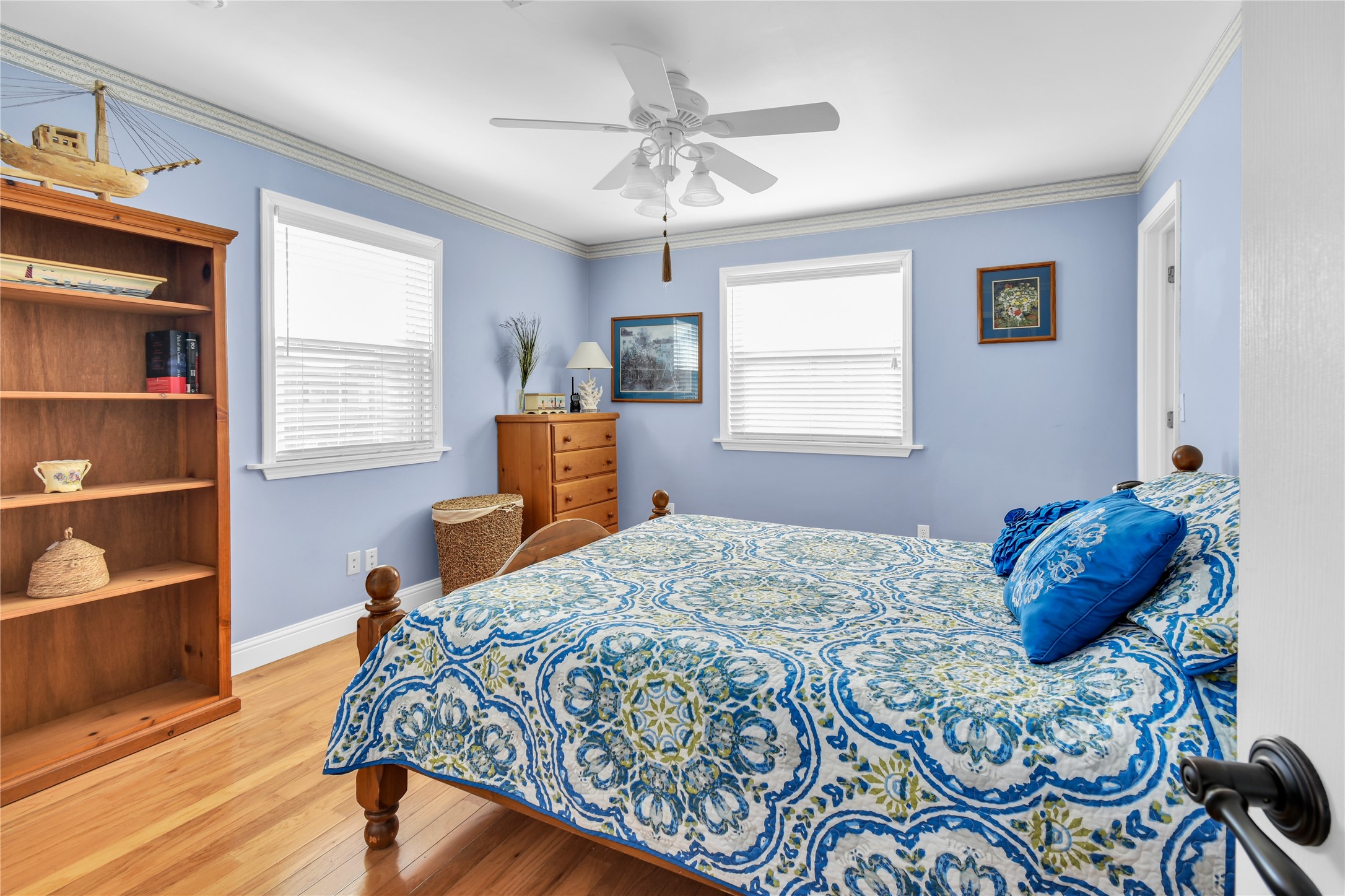 114 Four Master Road Freeport, TX 77541 - Photo 26 of 37 a bedroom with a bed and a chandelier