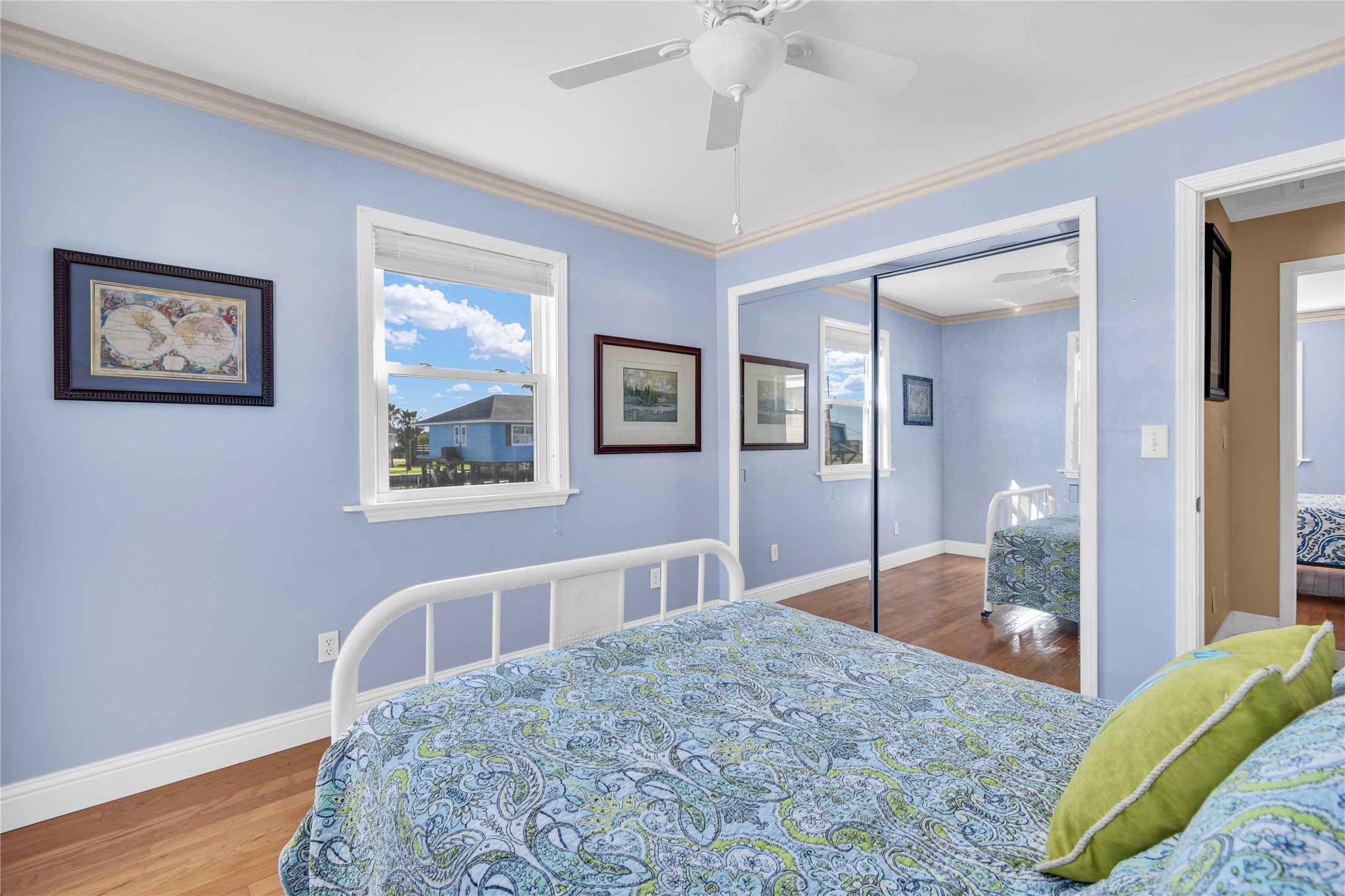 114 Four Master Road Freeport, TX 77541 - Photo 30 of 37 a bedroom with a bed and a chandelier