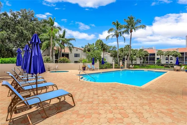a view of swimming pool with chairs