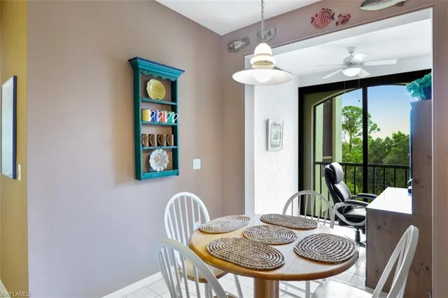 a view of a dining room with furniture window and outside view