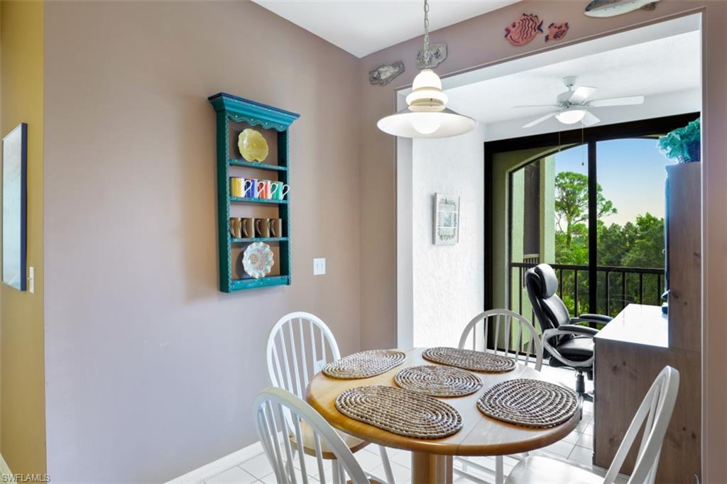 6500 Valen Way, Unit A305 Naples, FL 34108 - Photo 11 of 22 a view of a dining room with furniture window and outside view