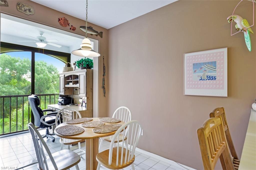 6500 Valen Way, Unit A305 Naples, FL 34108 - Photo 12 of 22 a dining room with furniture window and outside view