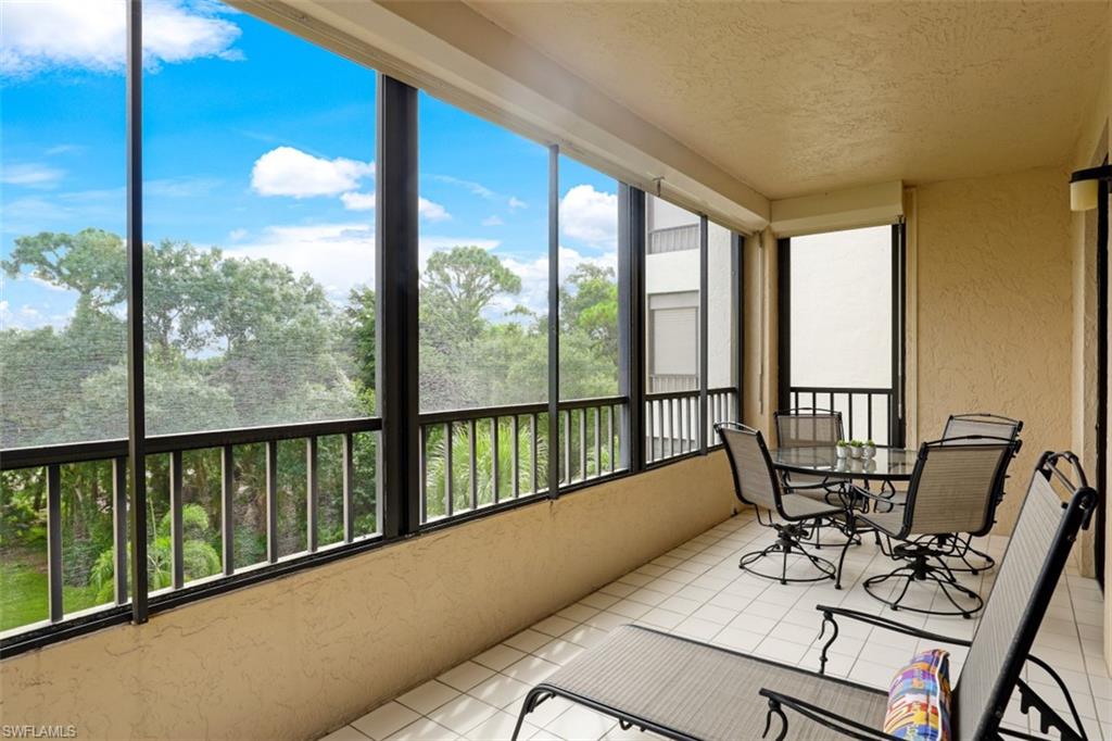 6500 Valen Way, Unit A305 Naples, FL 34108 - Photo 22 of 22 a view of a balcony with chairs