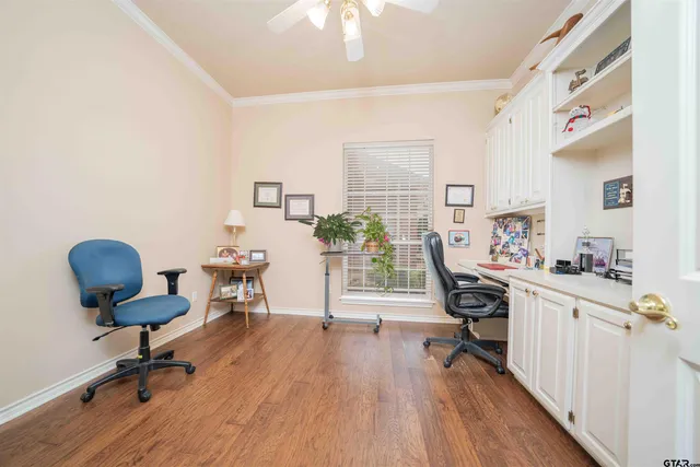 a workspace with furniture and wooden floor