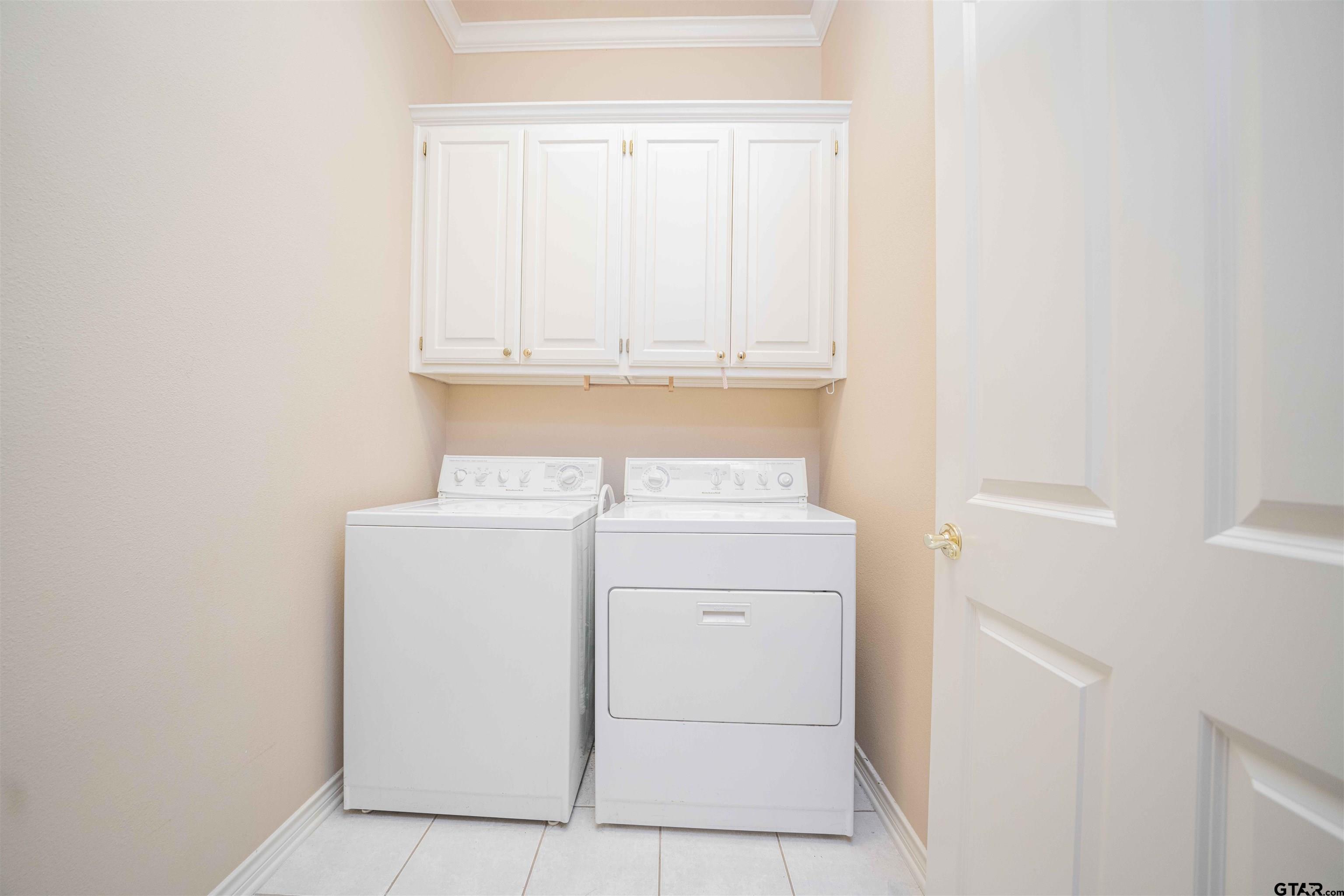 2215 Homestead Lane Tyler, TX 75701 - Photo 21 of 31 a utility room with dryer and washer