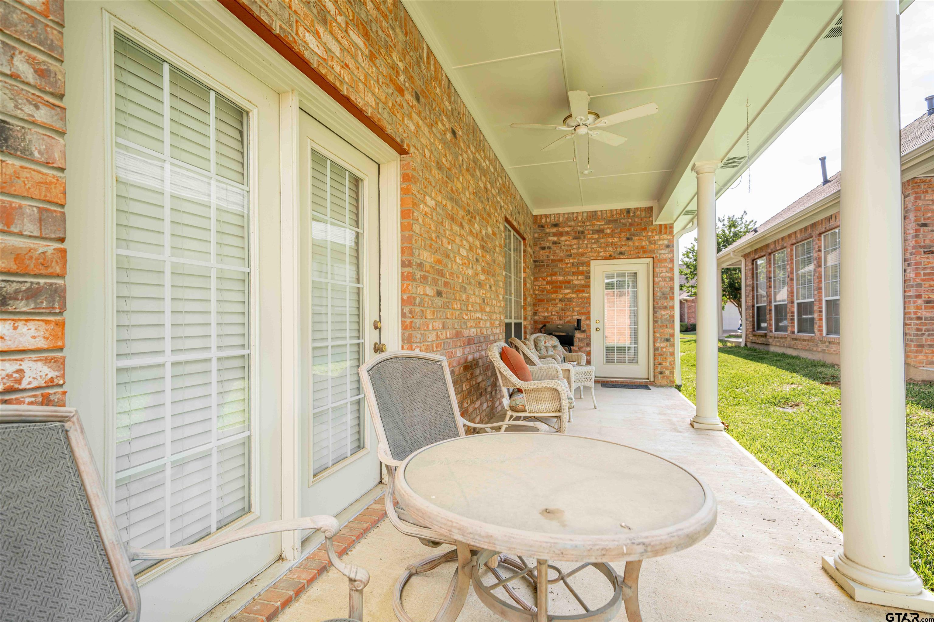 2215 Homestead Lane Tyler, TX 75701 - Photo 23 of 31 a balcony with table and chairs