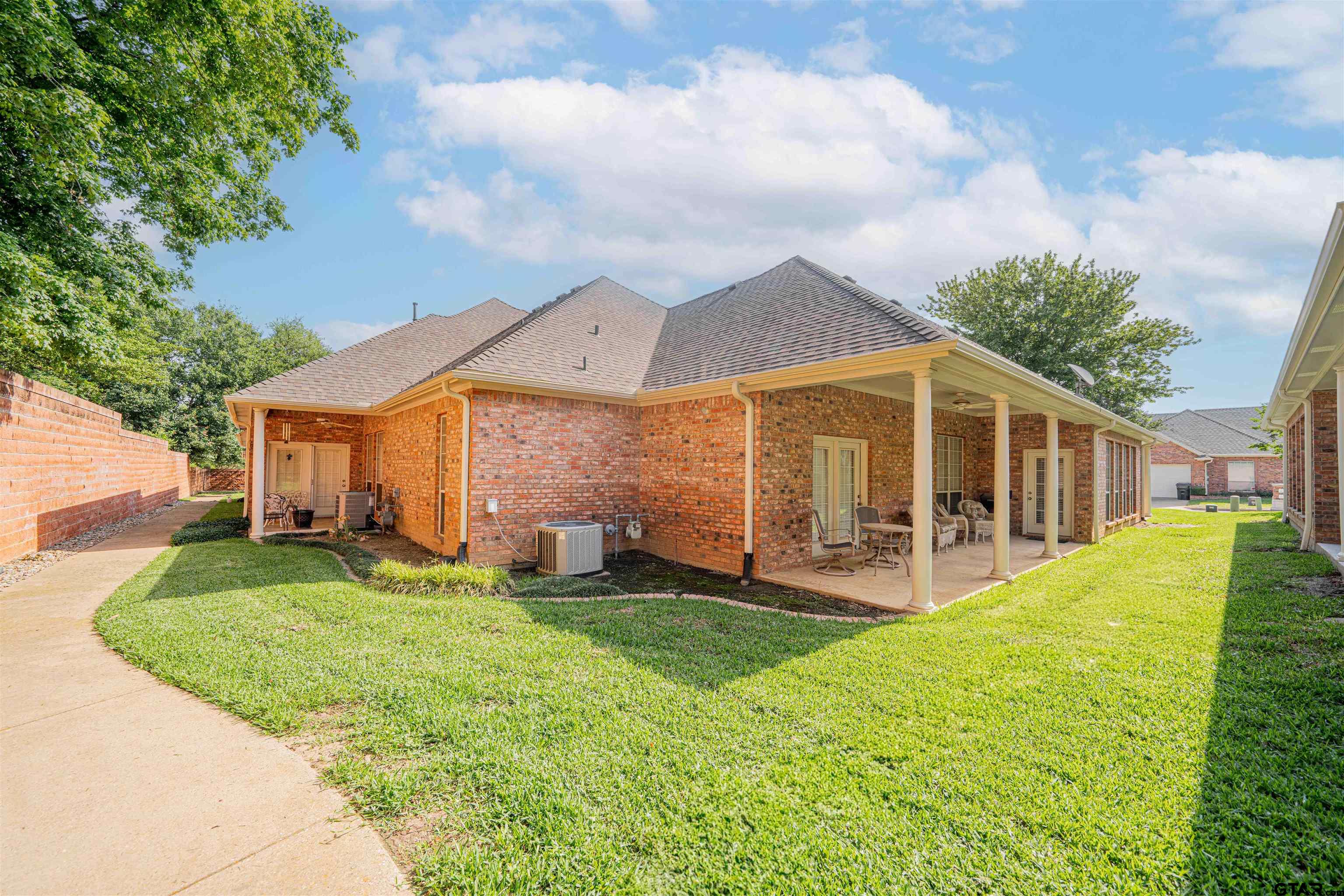 2215 Homestead Lane Tyler, TX 75701 - Photo 24 of 31 a view of a house with a yard and sitting area