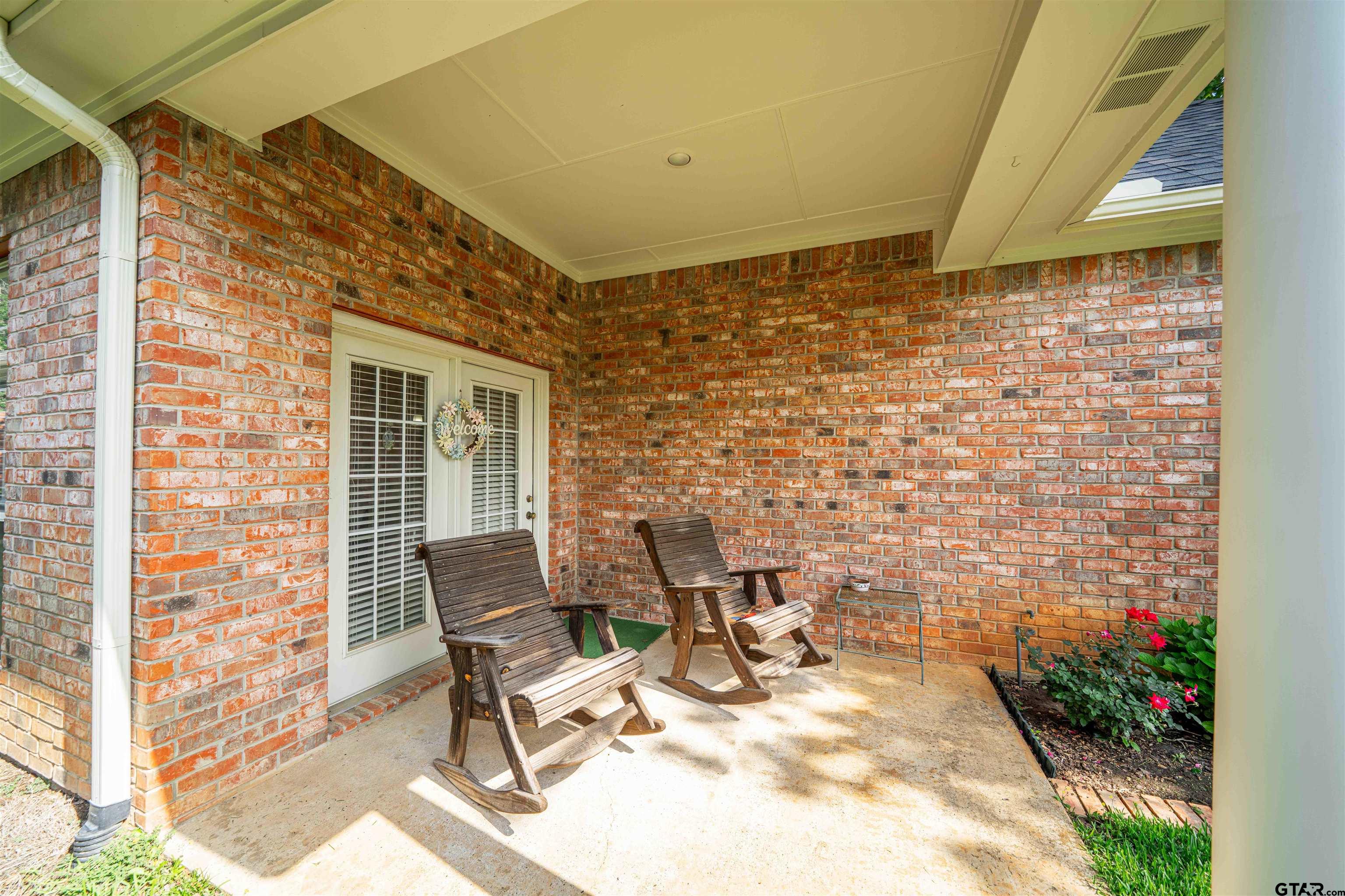 2215 Homestead Lane Tyler, TX 75701 - Photo 26 of 31 a building outdoor space with patio furniture and potted plants