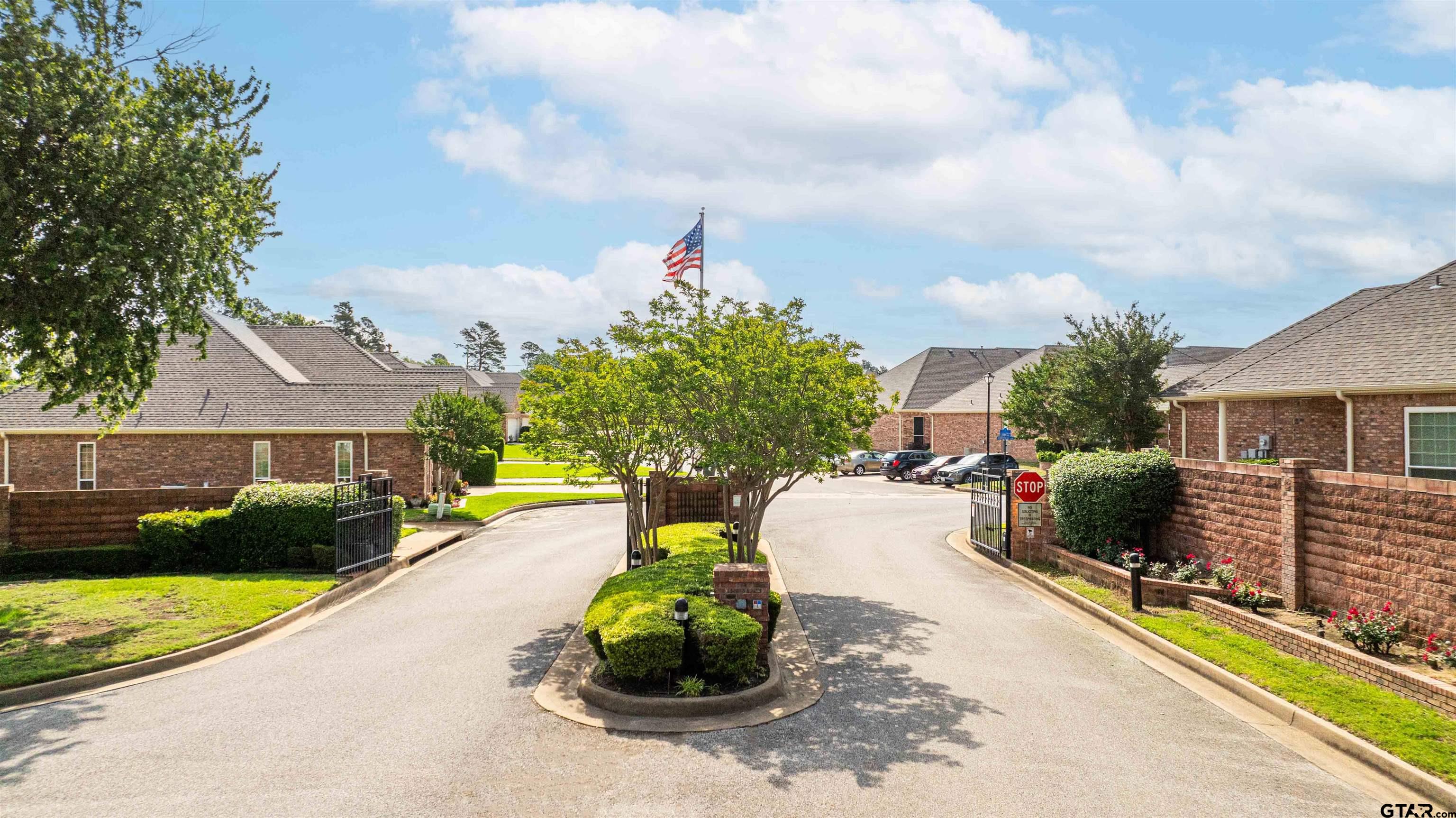 2215 Homestead Lane Tyler, TX 75701 - Photo 4 of 31 a view of a street with couches and a fire pit