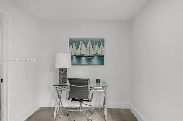 a workspace with furniture and a potted plant