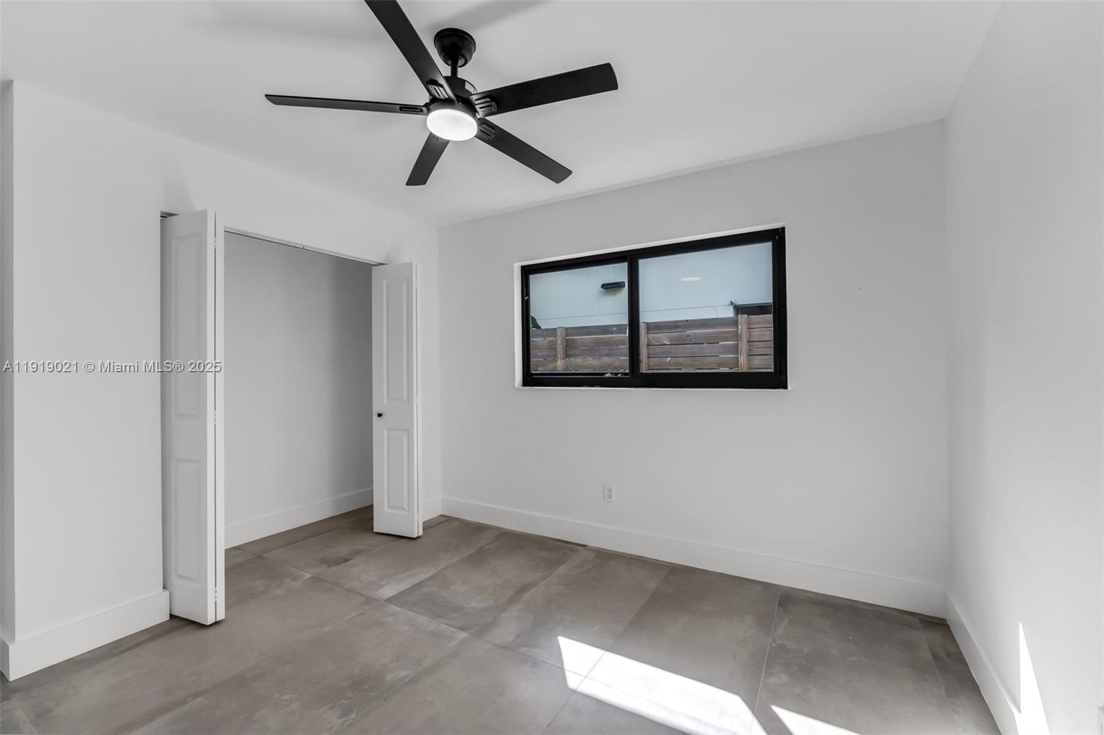 7120 Southwest 92nd Avenue Miami, FL 33173 - Photo 17 of 37 a view of a hallway with a ceiling fan