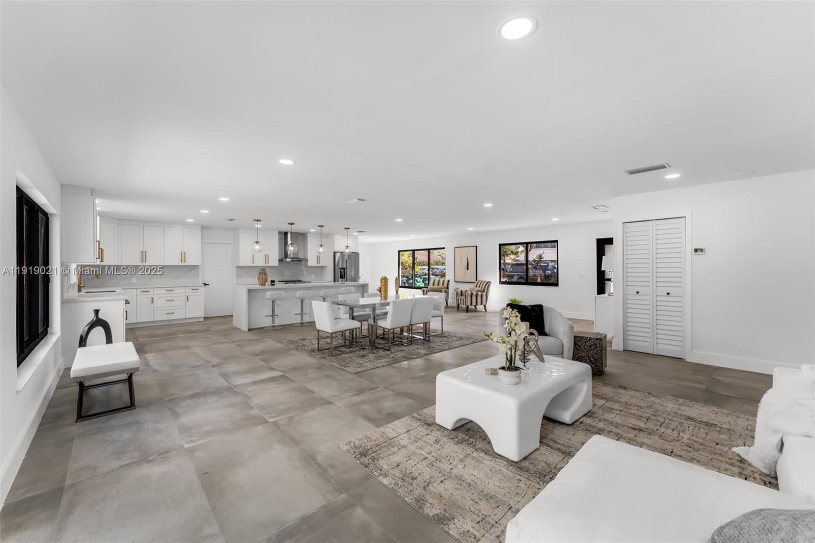 7120 Southwest 92nd Avenue Miami, FL 33173 - Photo 32 of 37 a living room with furniture and kitchen view