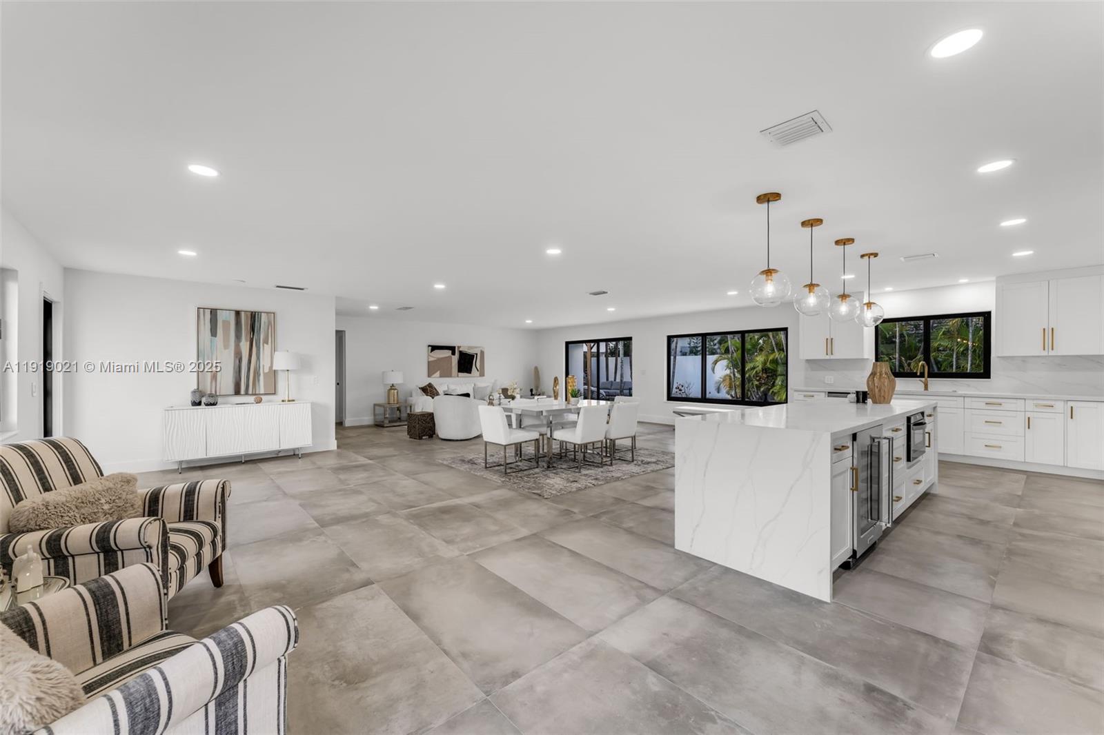 7120 Southwest 92nd Avenue Miami, FL 33173 - Photo 34 of 37 a living room with furniture and a flat screen tv