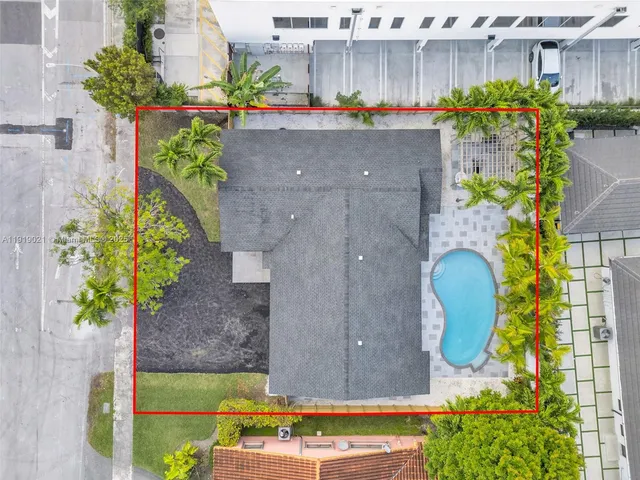 a view of a swimming pool with sitting area