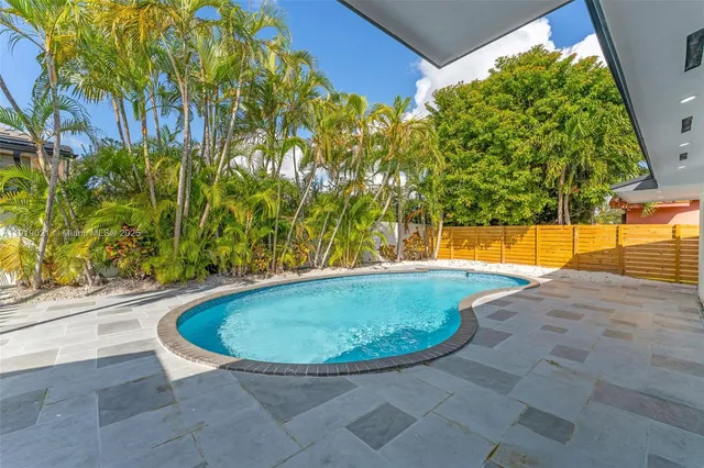 a view of a swimming pool with an outdoor space