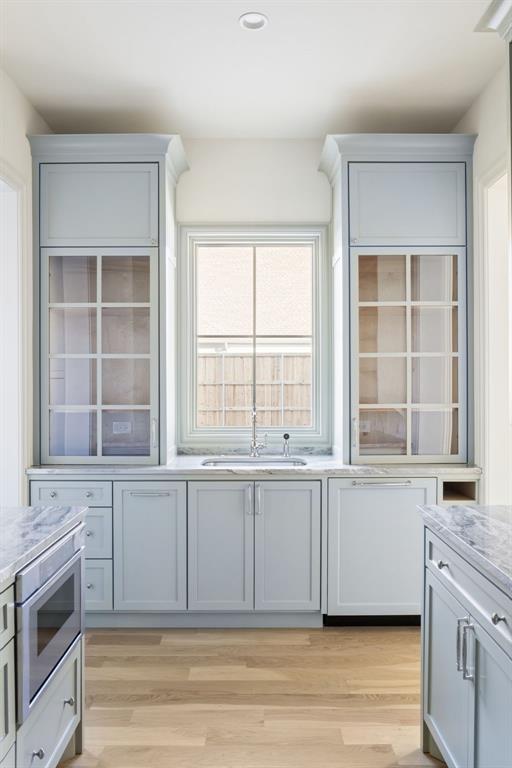 512 Bandit Trail Colleyville, TX 76034 - Photo 20 of 29 a view of a kitchen with granite countertop a sink and a stove top oven