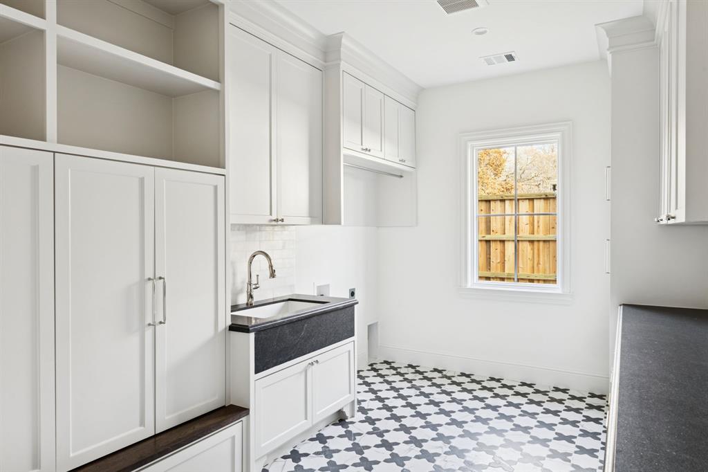 512 Bandit Trail Colleyville, TX 76034 - Photo 21 of 29 a kitchen with granite countertop a sink a stove and refrigerator